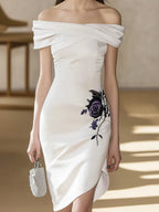 Chic White Satin Dress Featuring Asymmetric Hem and Floral Embroidery
