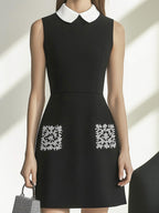 Stylish Black Dress with Peter Pan Collar and Embroidered Pockets