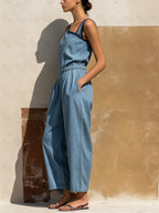 Light Wash Denim Asymmetric Jumpsuit | Elastic Waist With Pockets