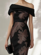 Elegant Black Off-the-Shoulder Dress with Gold Leaf Print