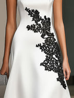 Stylish White Satin One-Shoulder Dress with Black Lace Detail